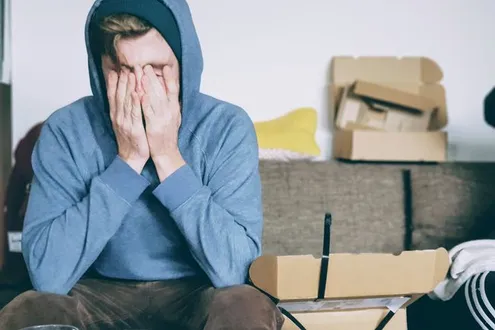 Depressed young man sugaring with anxiety caused by addiction.