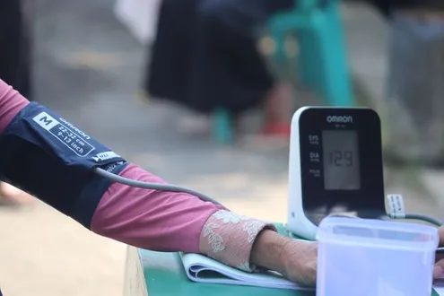 A person is having their blood pressure taken highlighting everything you need to know about alcohol and blood pressure